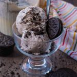 A serving glass containing two scoops of Ninja Creami cookies and cream ice cream.