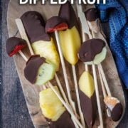Chocolate dipped fruit with a text overlay title.