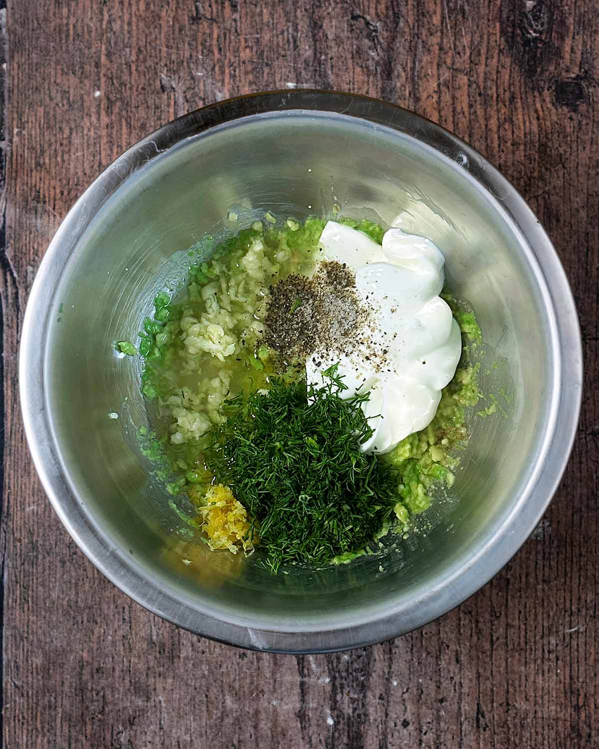 Yogurt, avocado, lemon juice, zest and dill in a mixing bowl.
