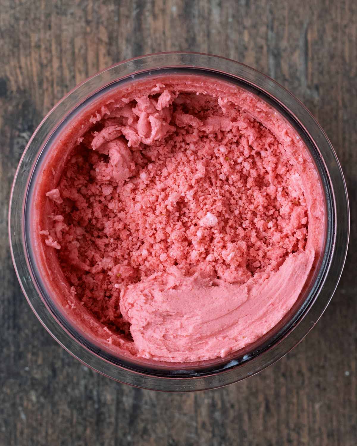 A crumbly strawberry ice cream in the pint tub.