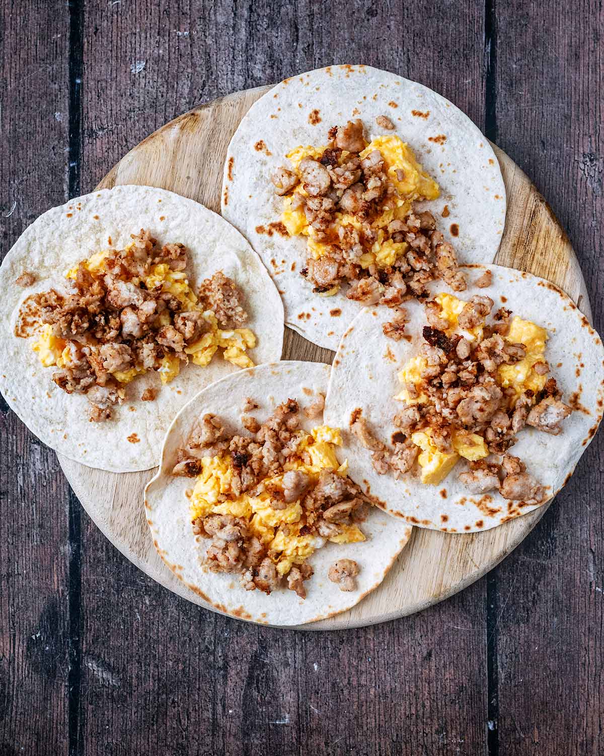 Cooked sausage meat added on top of the eggs.