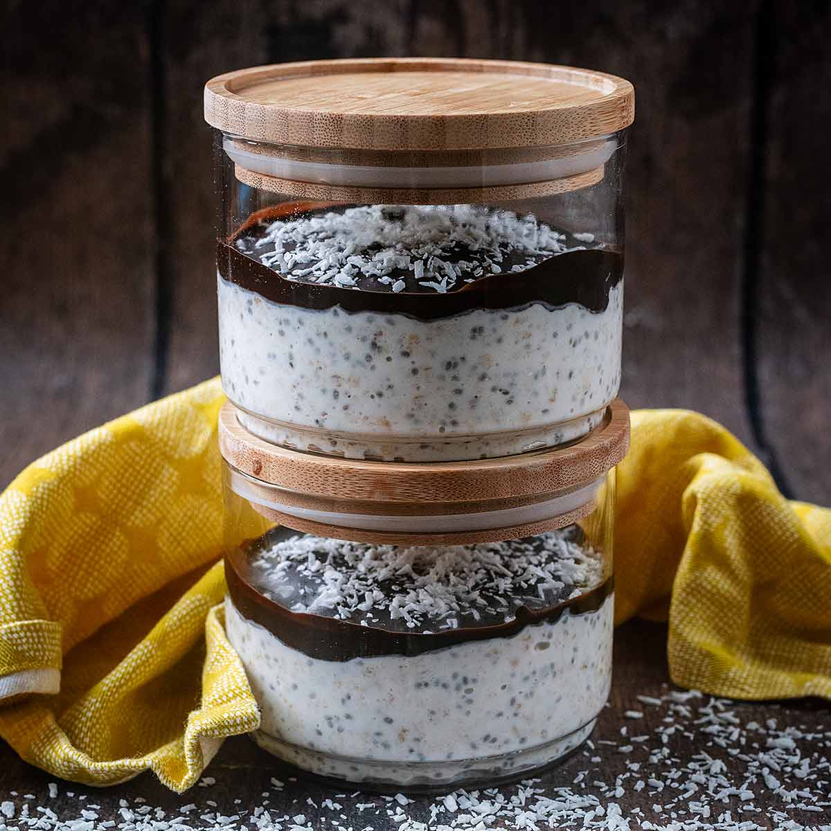 Two jars of coconut overnight oats stacked up.