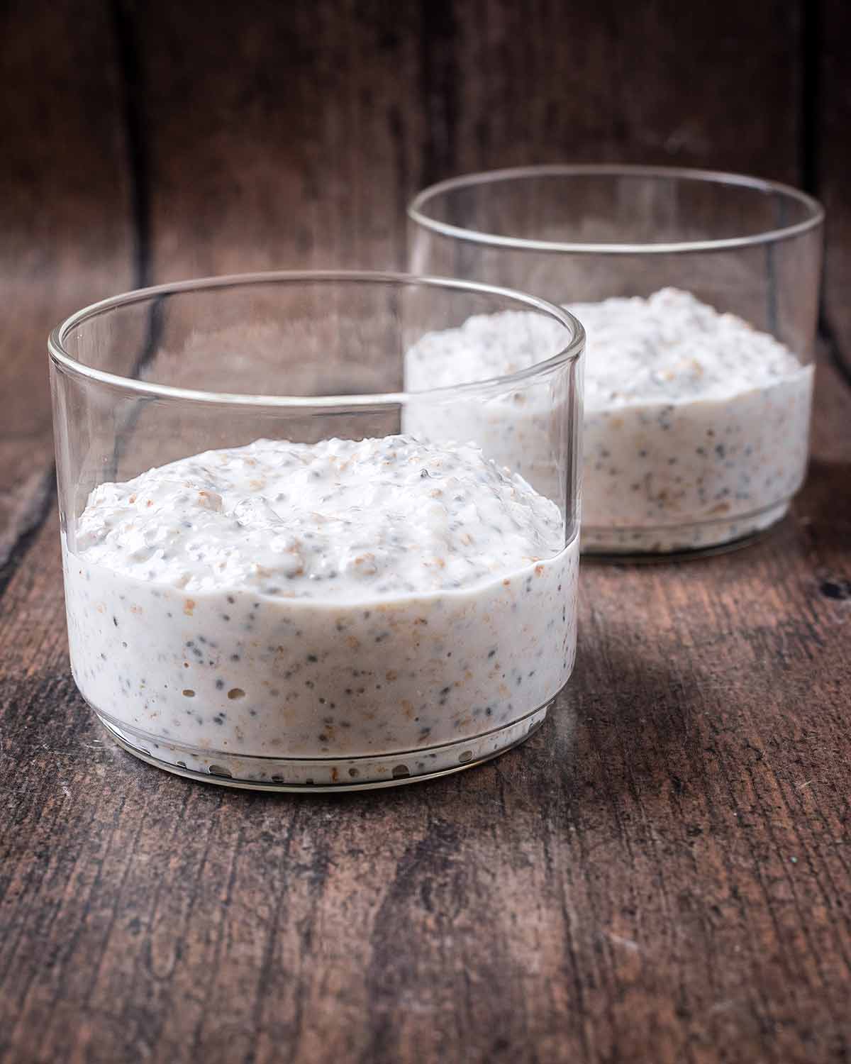 Overnight oats mixture in two glass jars.