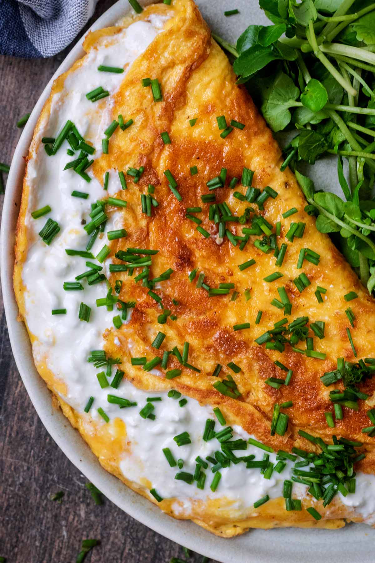 Melted cottage cheese oozing out of an omelette.