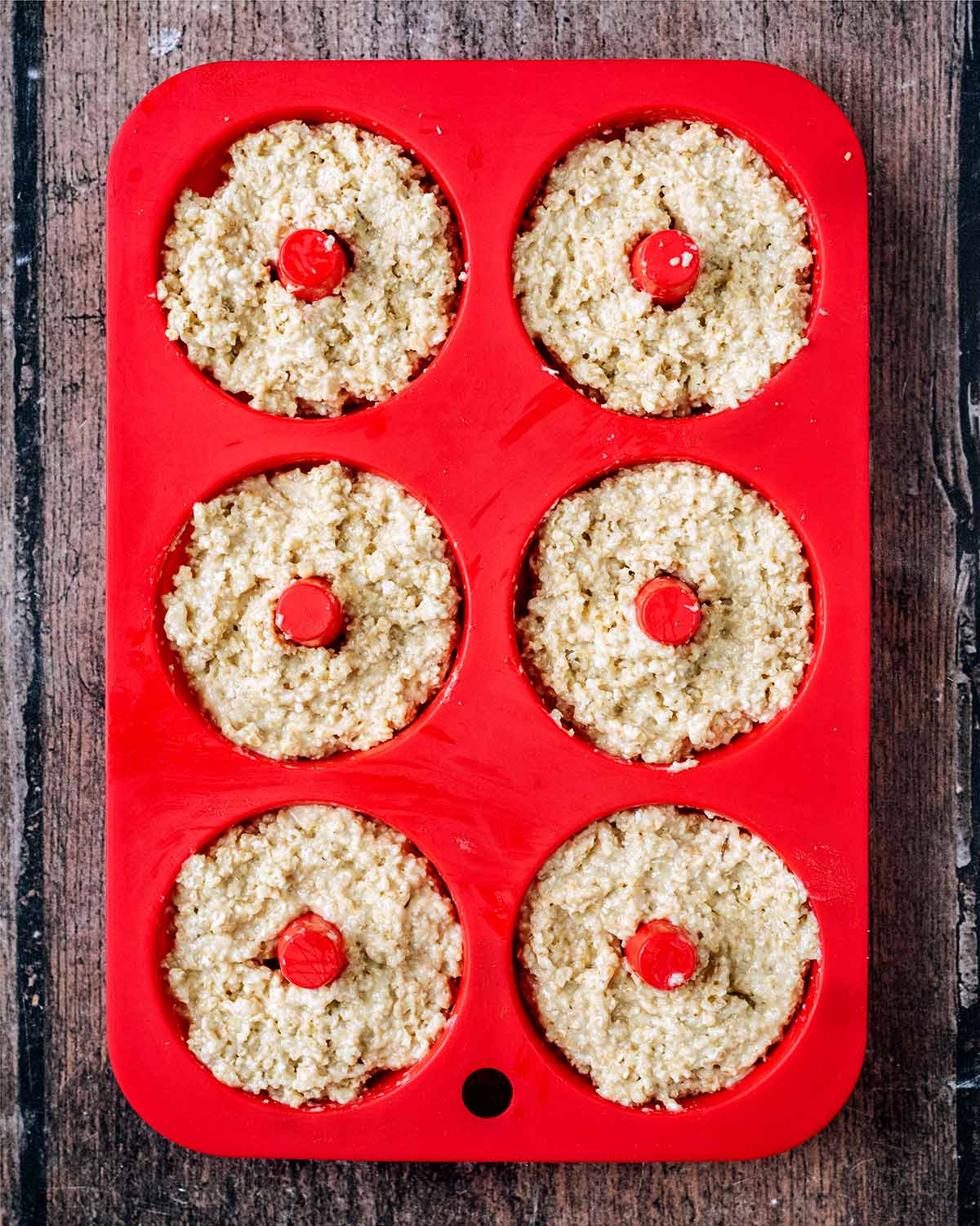 Donut batter poured into a silicone donut mould.