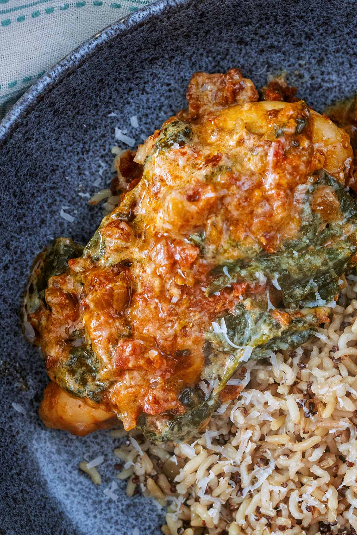 Cooked chicken breast in a creamy tomato sauce.