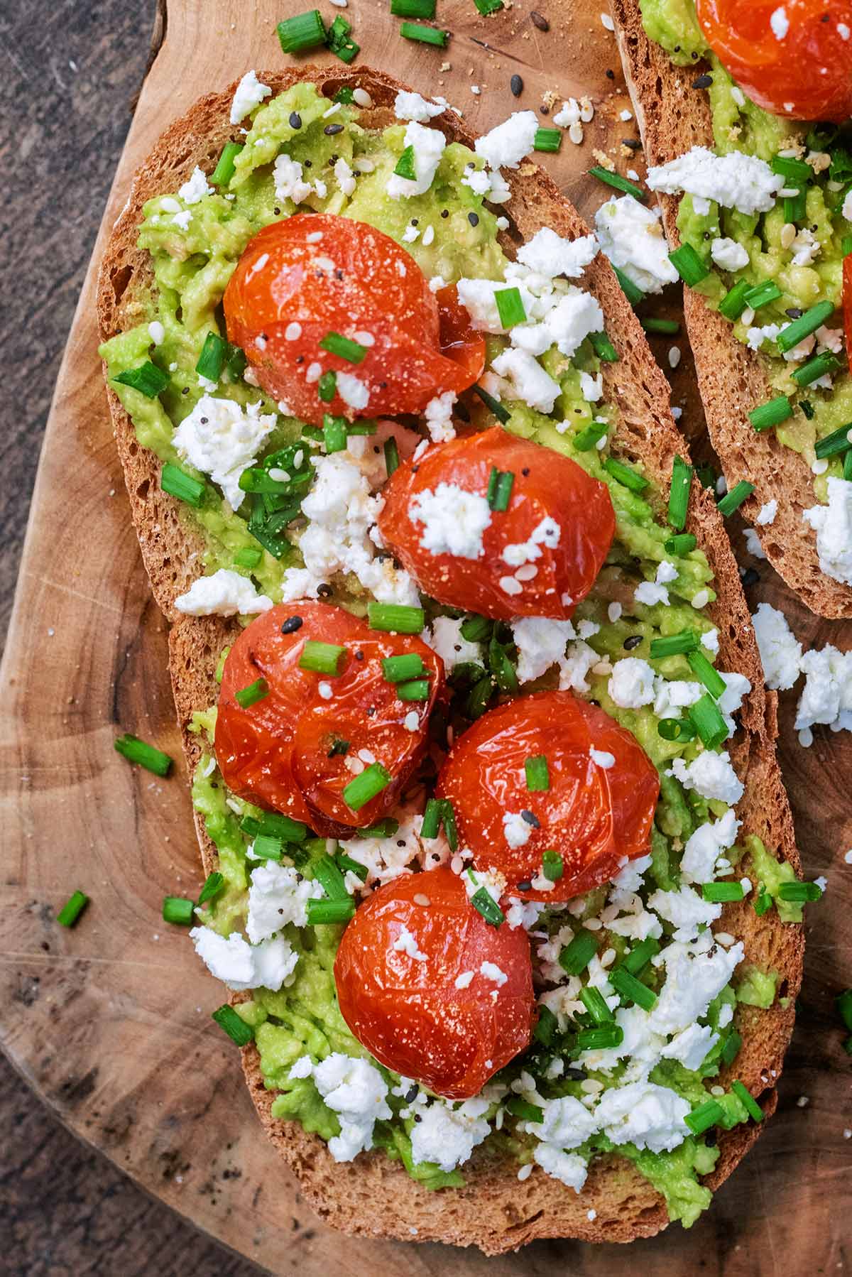 Roasted tomatoes, crumbled feta and chopped chives on top of sourdough toast.