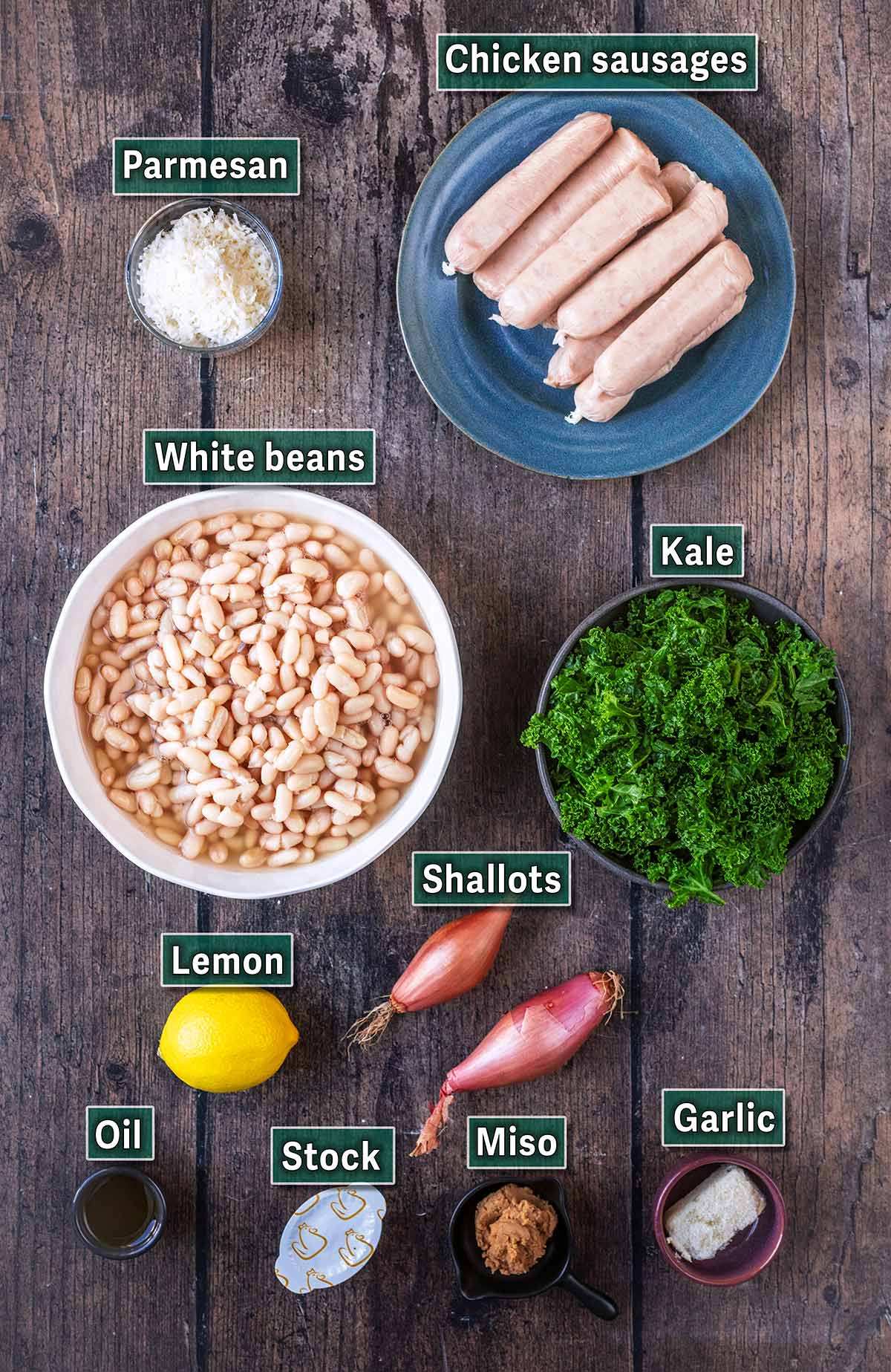 White bean and sausage skillet with a text overlay title.