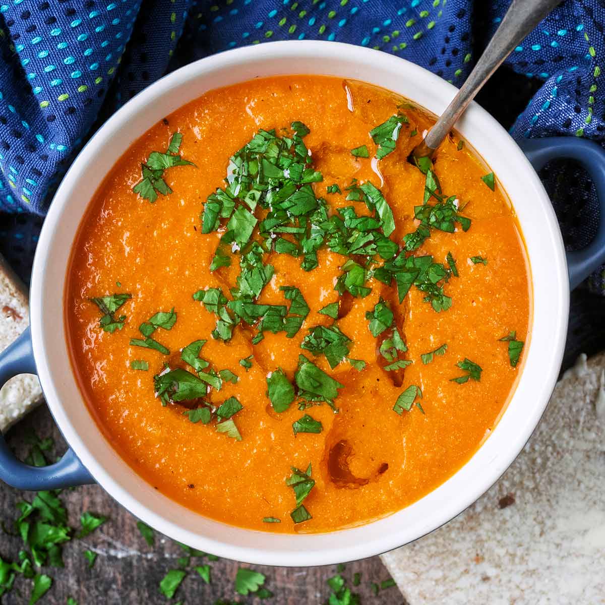 High protein tomato soup in a bowl with a spoon.
