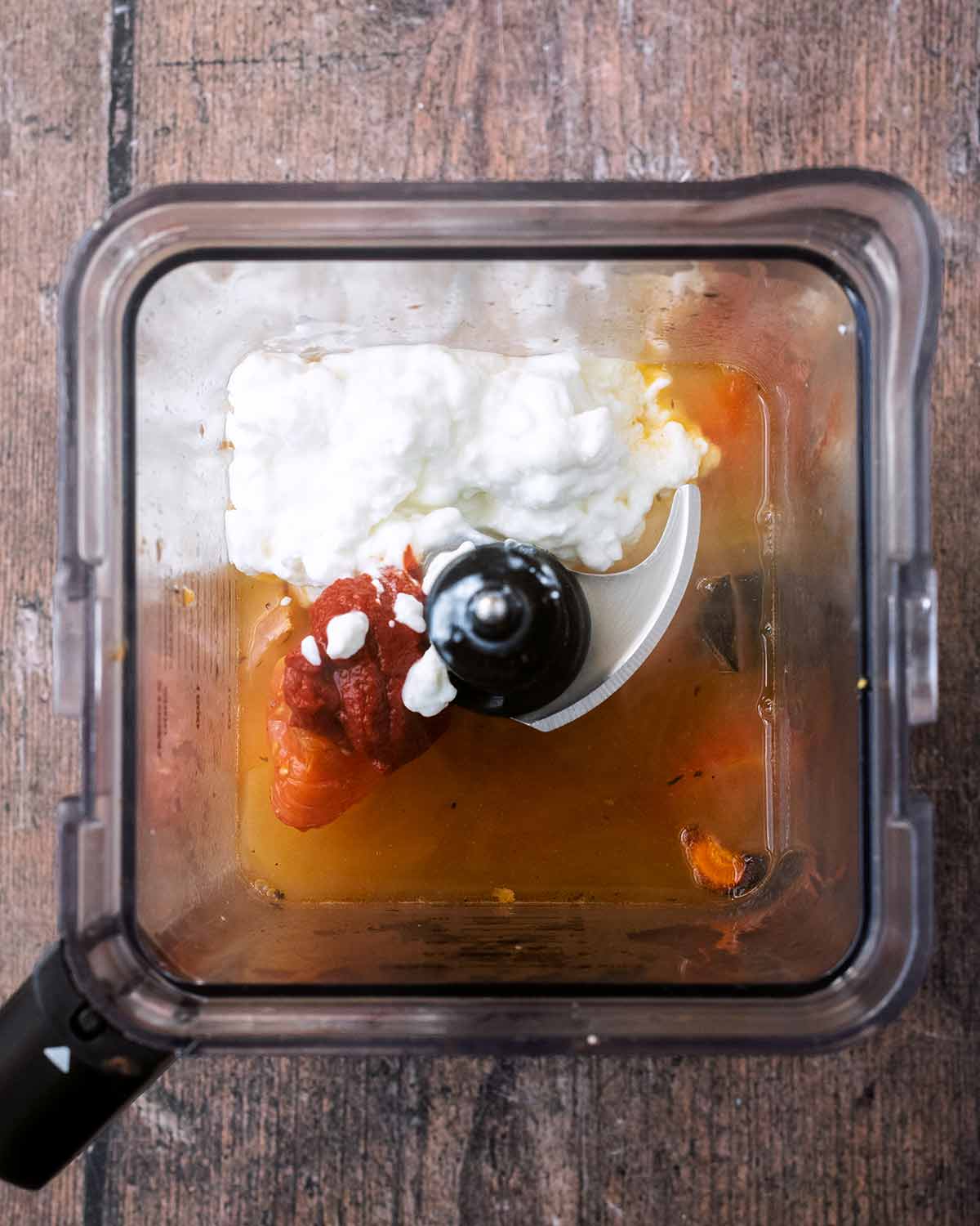 The roasted veg, stock and cottage cheese in a blender jug.