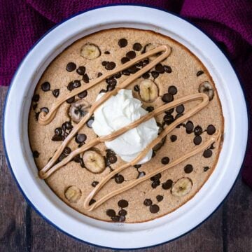 Banana bread baked oats in a round baking dish.