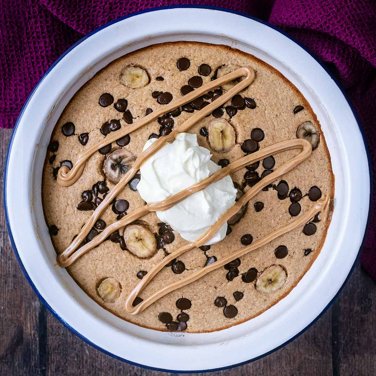 Banana bread baked oats in a round baking dish.