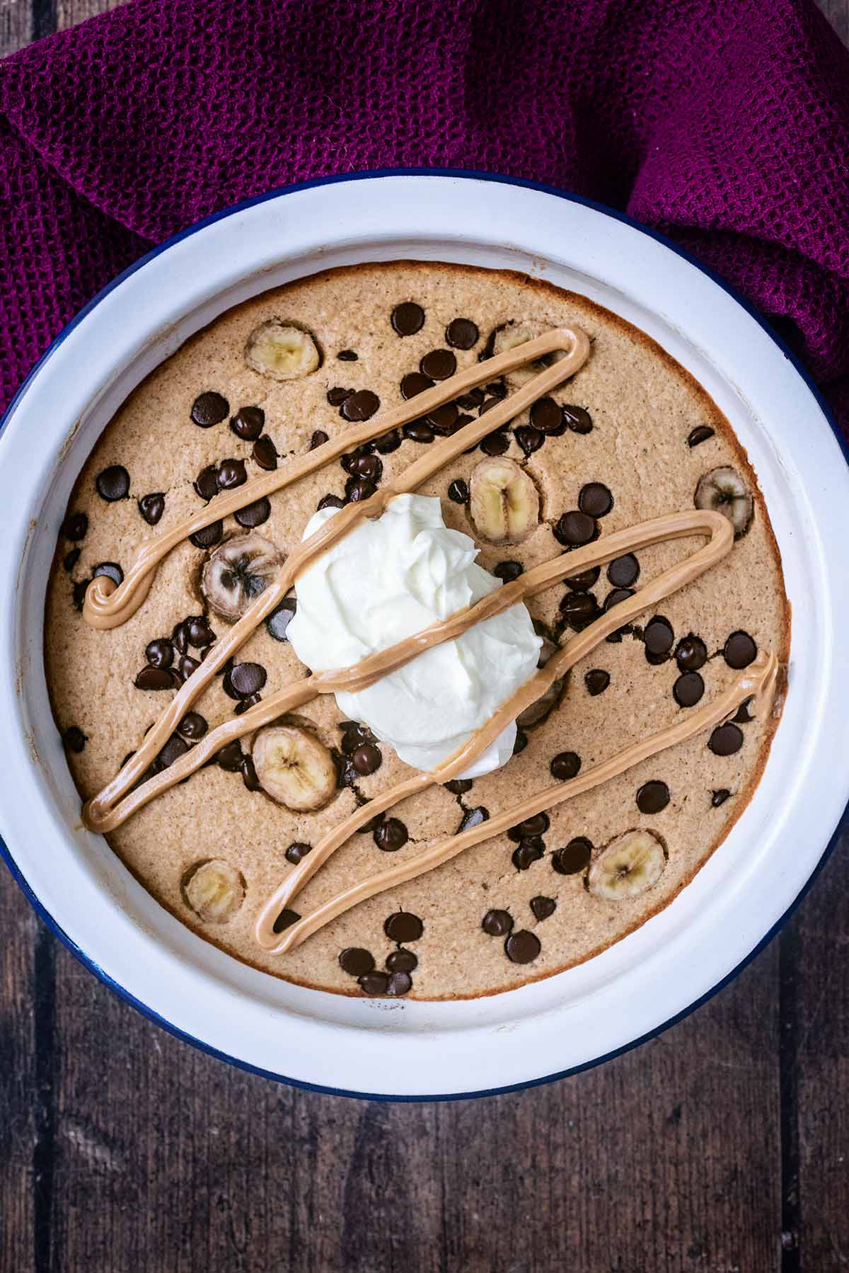 Baked oats topped with a dollop of yogurt and peanut butter.