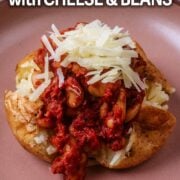 Jacket potato with cheese and beans and a text overlay title.