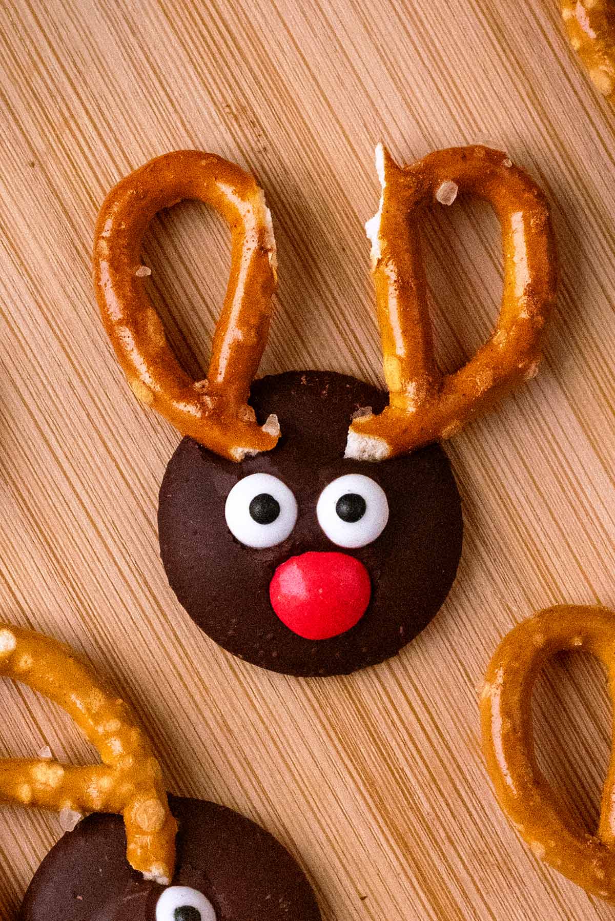 A chocolate button decorated to look like a reindeer.