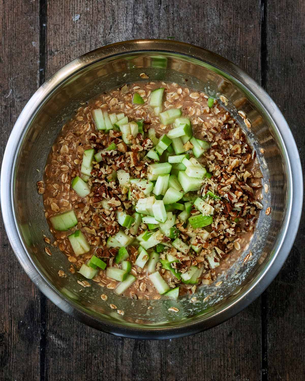 Chunks of apple added to the bowl.