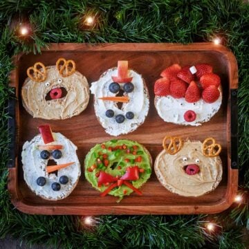 Six Christmas Bagels on a rectangular board.