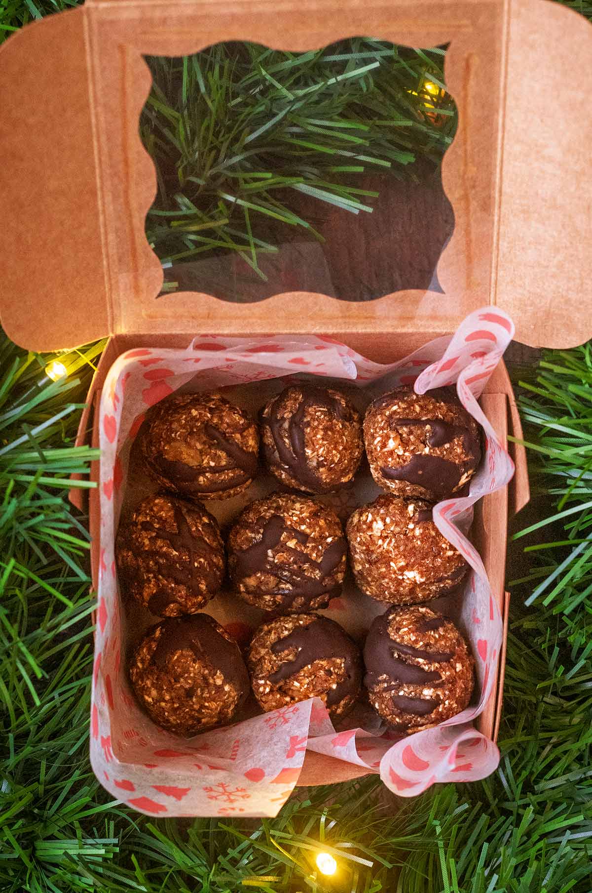 A presentation box with nine energy balls in it.