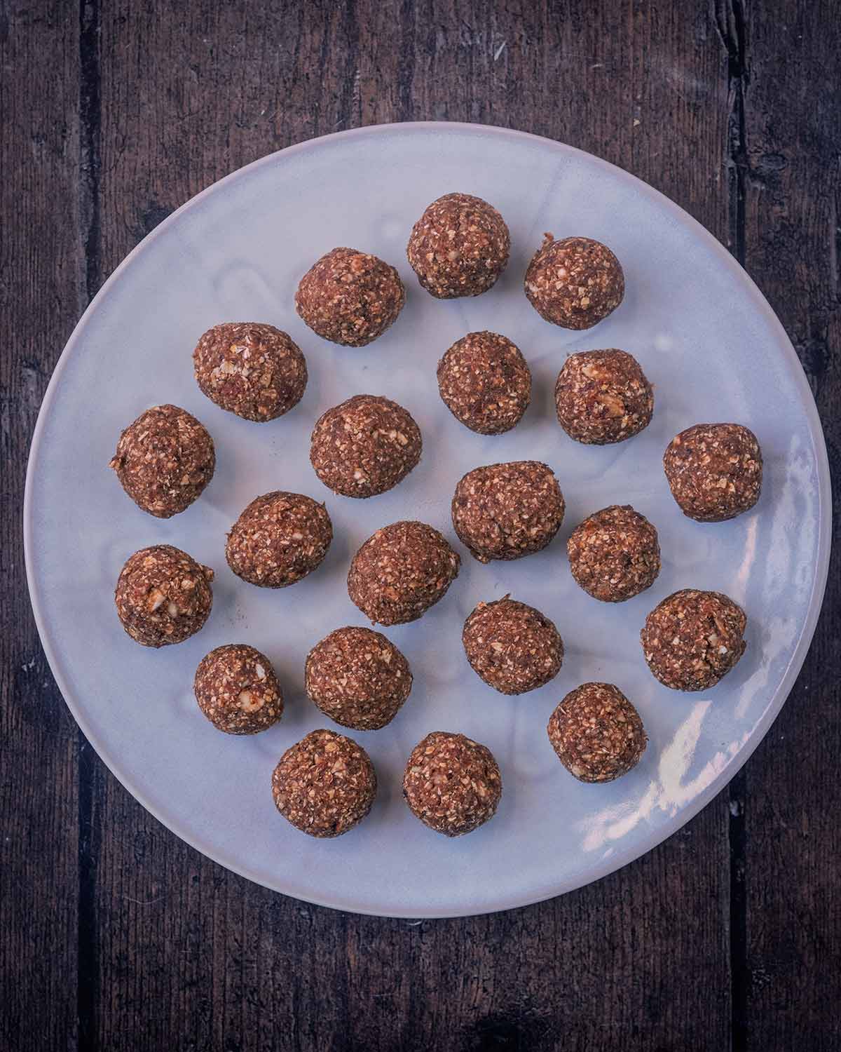 Twenty one energy balls on a round plate.
