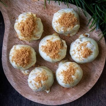 Seve Gingerbread Truffles on a small wooden board.