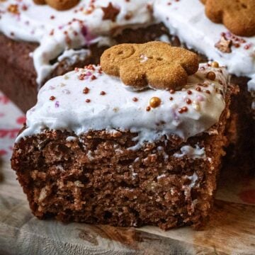 Healthy gingerbread cake topped with frosting an a gingerbread person.