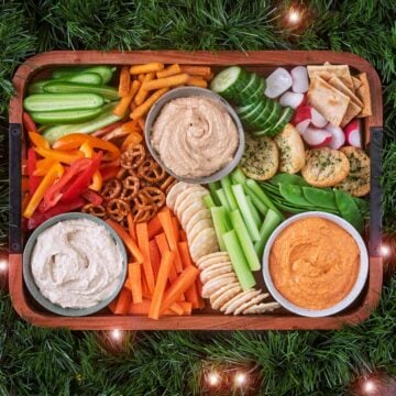Hummus platter surrounded by a green garland.