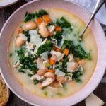 A bowl of chicken and white bean soup.