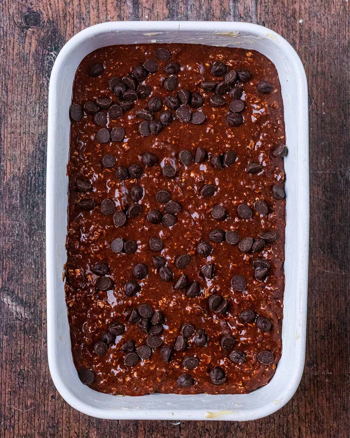 Chocolate batter ppoured into a rectangular baking dish.