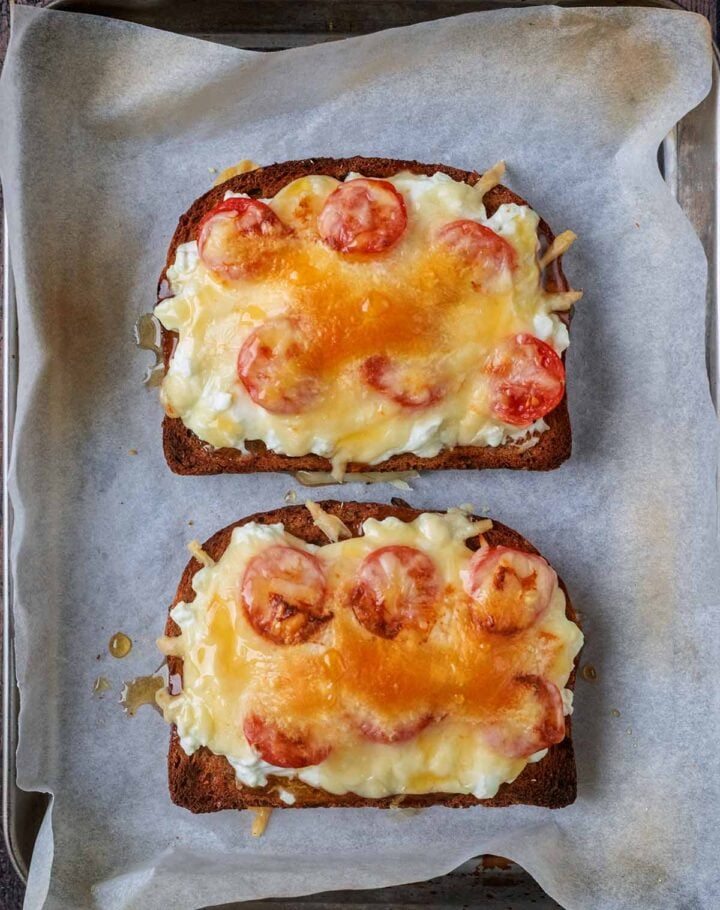 Melted cheese on top of the toast.