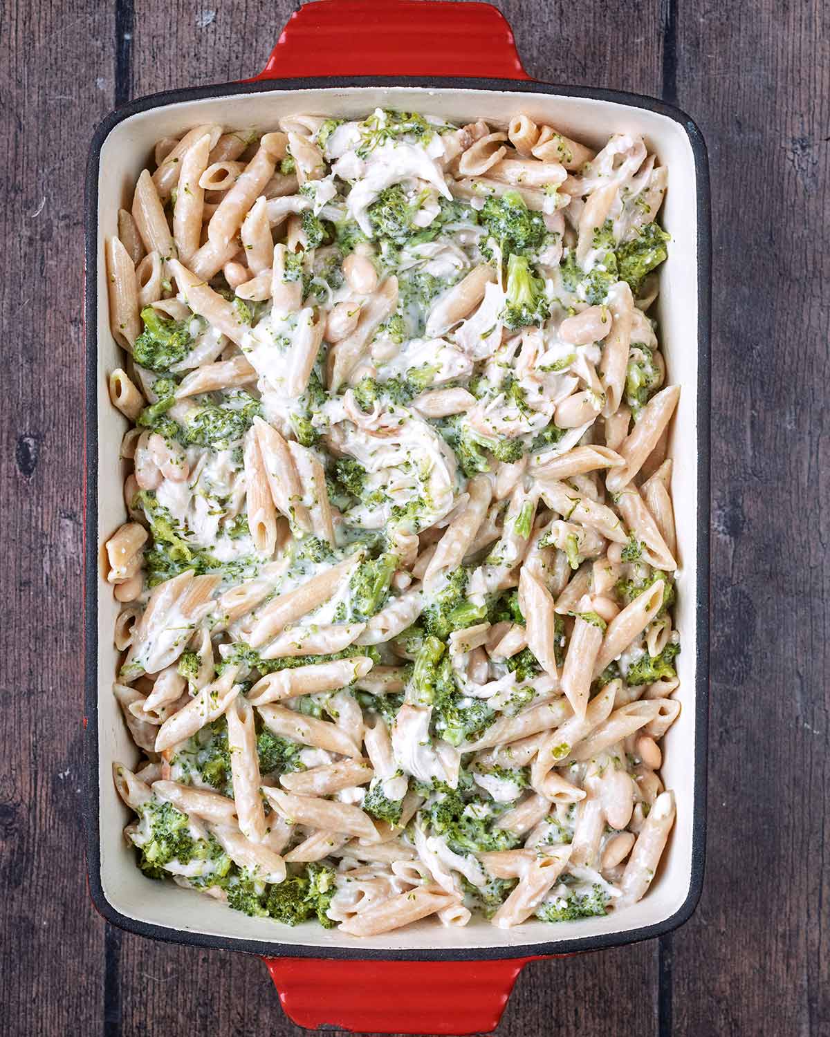 The cheesy pasta mixture transferred to a baking dish.