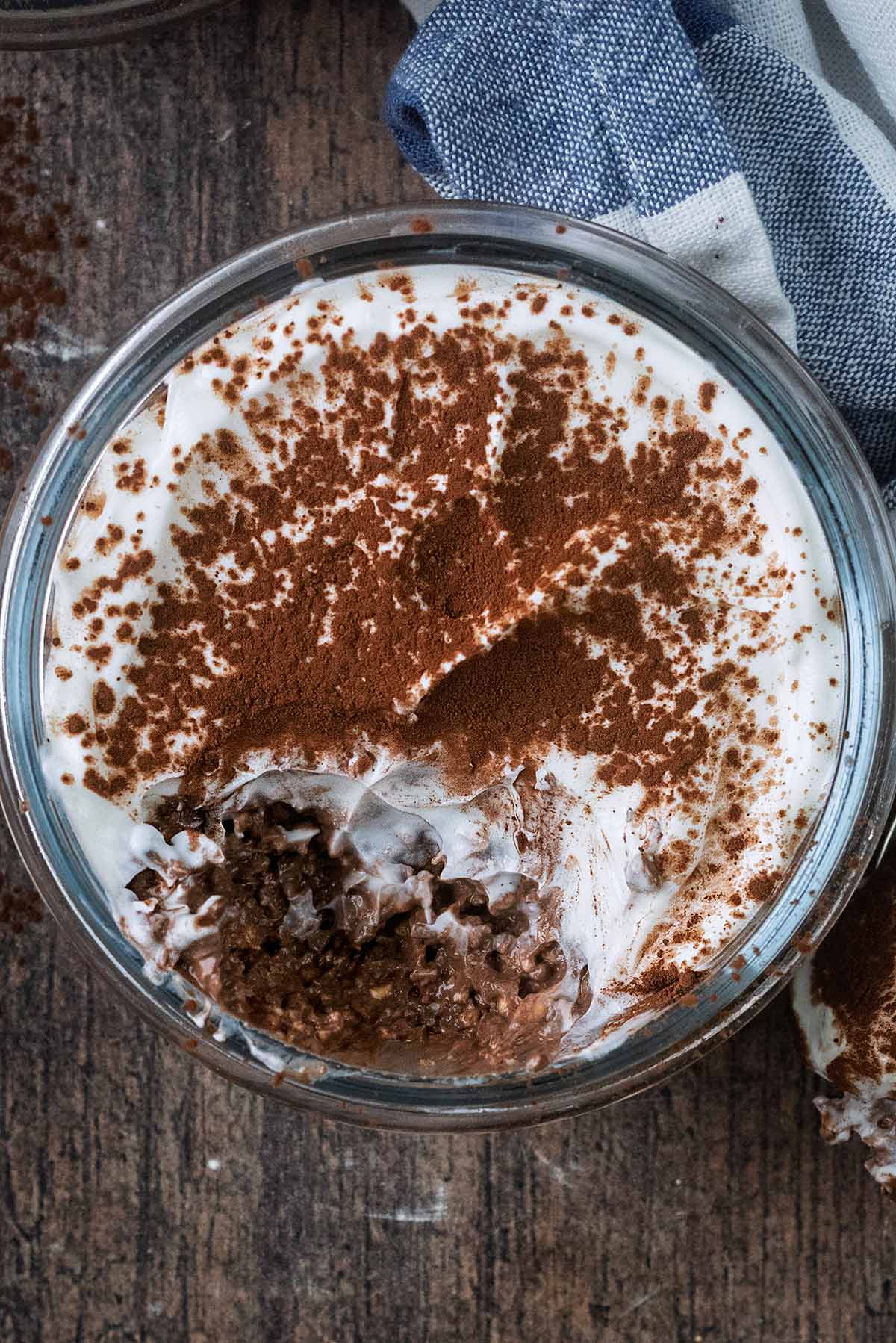 A jar of overnight oats with a spoonful taken out.
