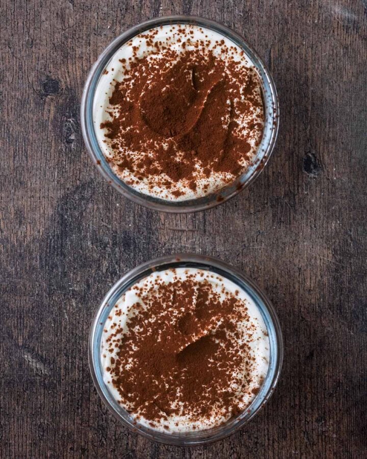 Yogurt and cocoa powder added to the top of the overnight oats.