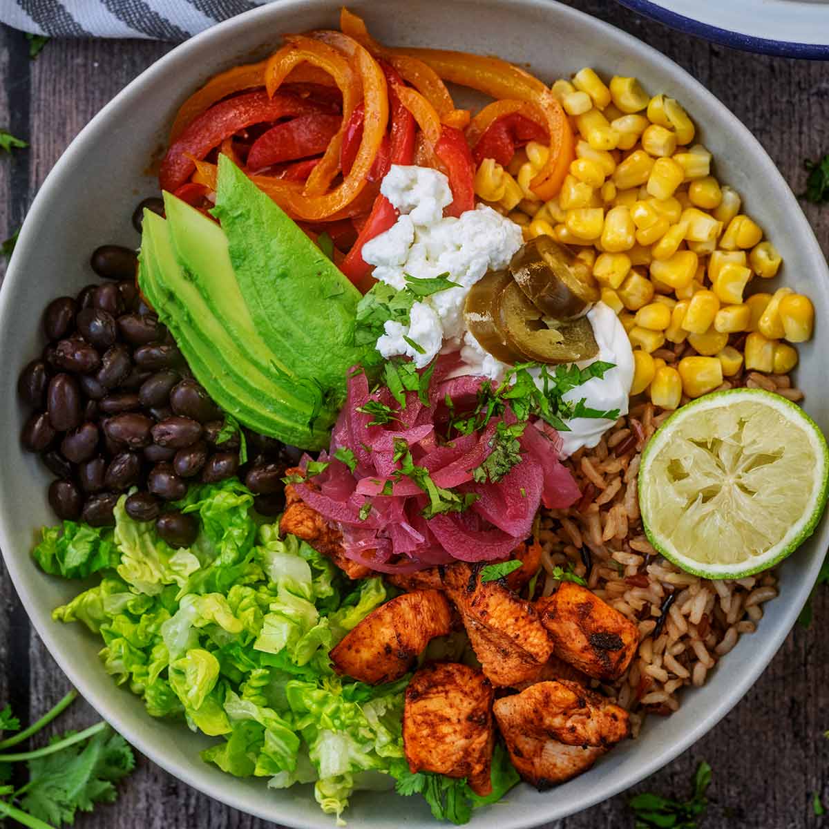 Chipotle Chicken Fajita Bowl on a wooden surface.