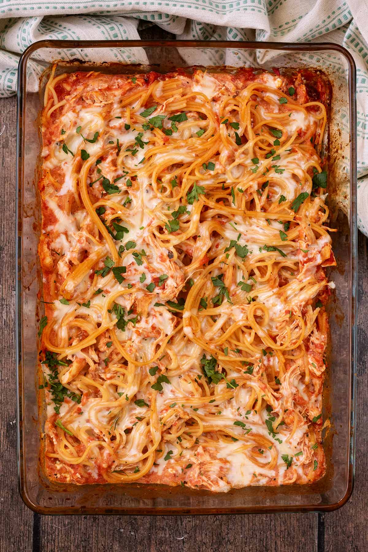 A large glass baking dish full of spaghetti bake.