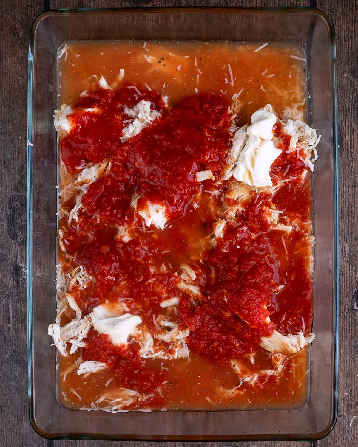 Chopped tomatoes and stock added to the baking dish.