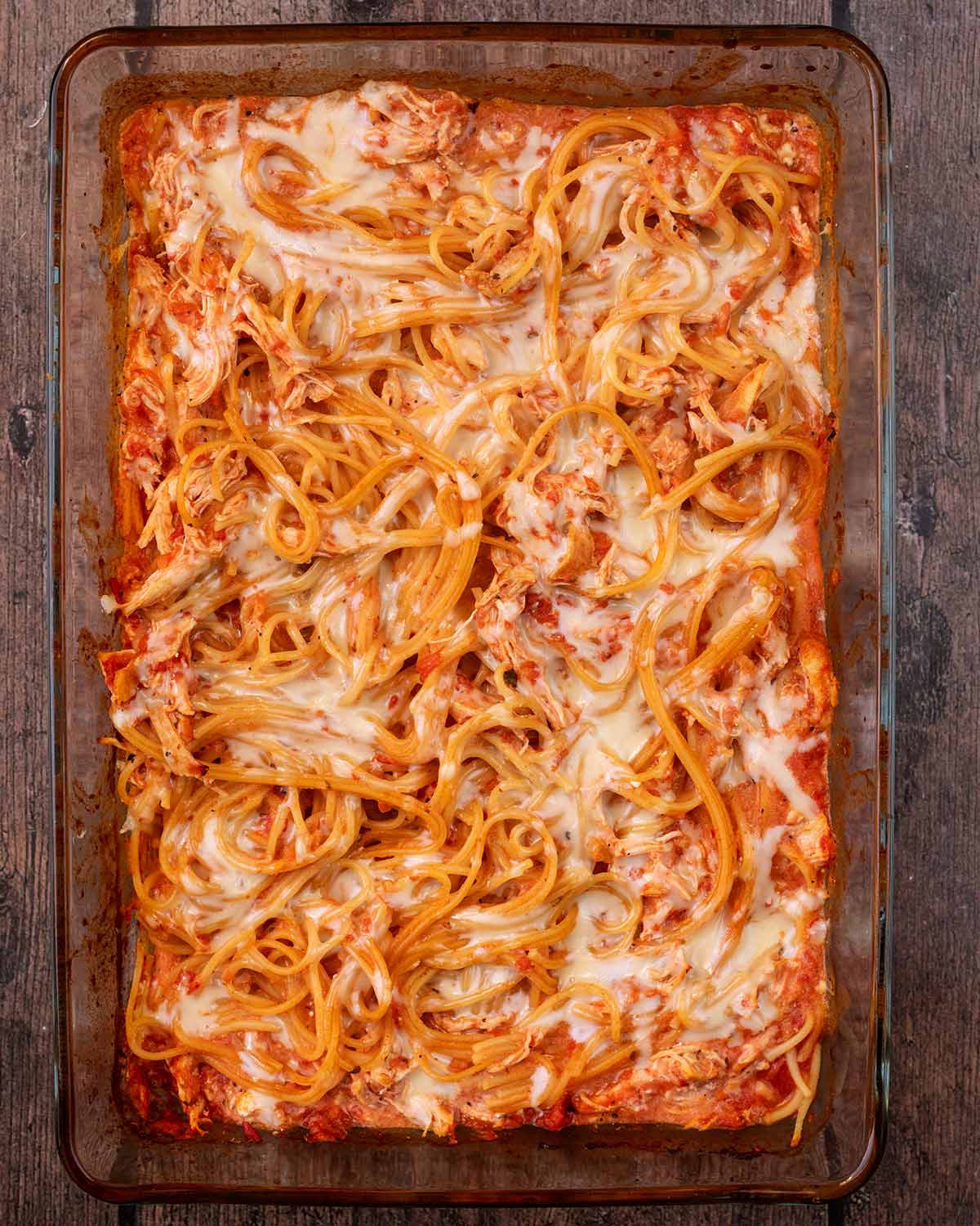 Melted cheese on top of the cooked spaghetti bake.