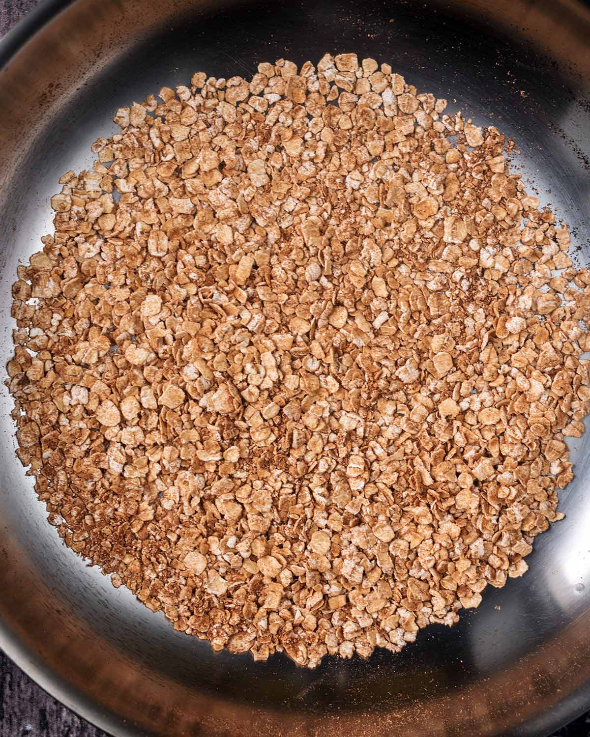 Toasted oats and cinnamon in the pan.
