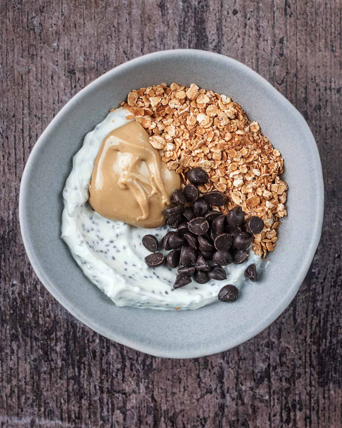 The yogurt topped with the toasted oats, nut butter and chocolate chips.