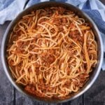 Hidden vegetable bolognese in a large silver pan.