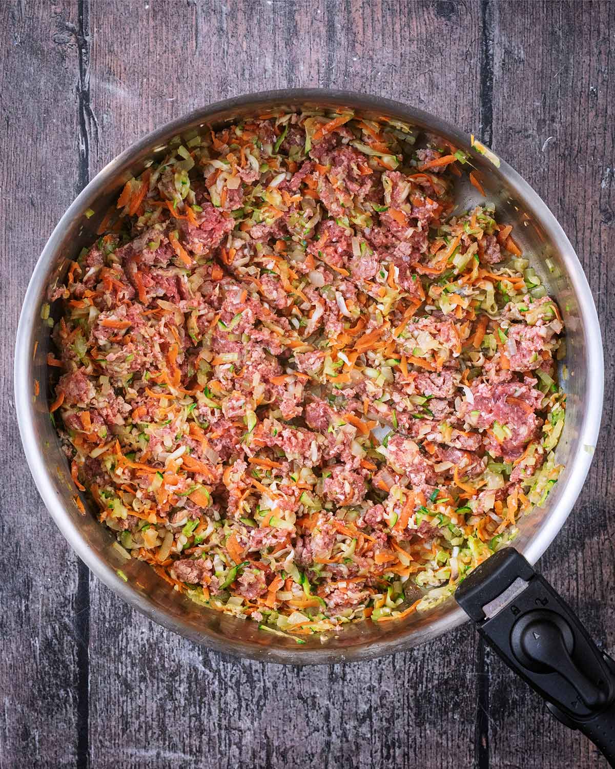 Beef mince added to the pan of vegetables.