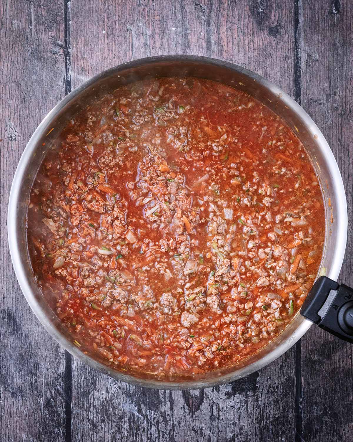 Passata and stock added to the pan.