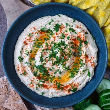 High protein cottage cheese hummus in a large blue bowl.