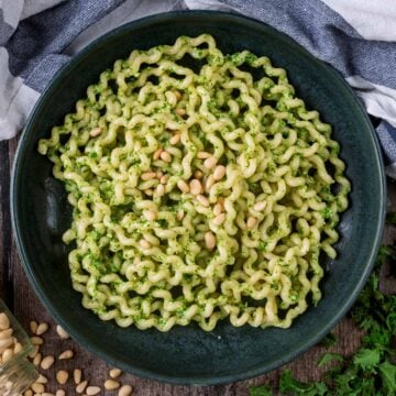 A large bowl of kale pesto pasta.