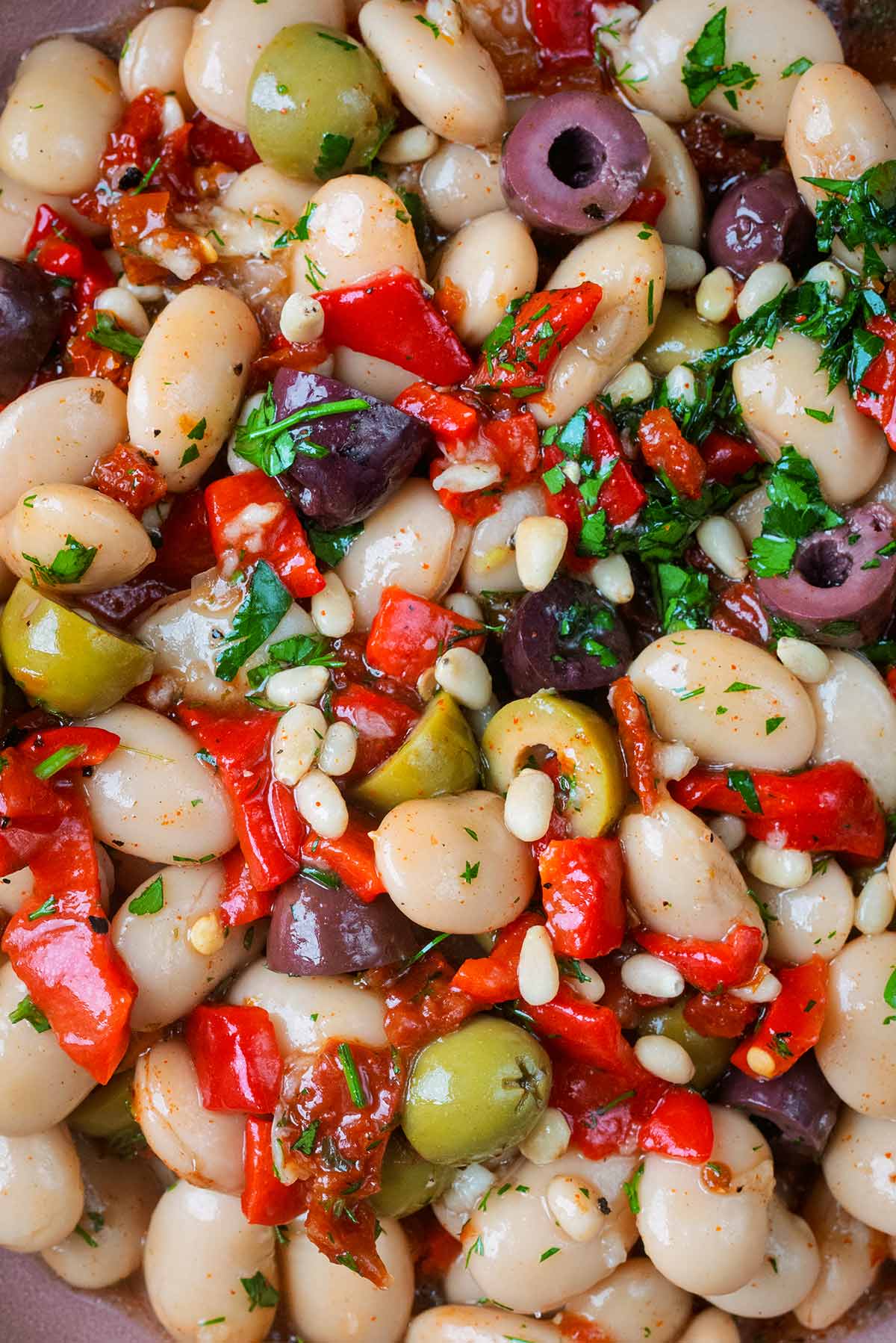 Marinated butter beans mixed with chopped tomatoes, chopped peppers, pine nuts and herbs.