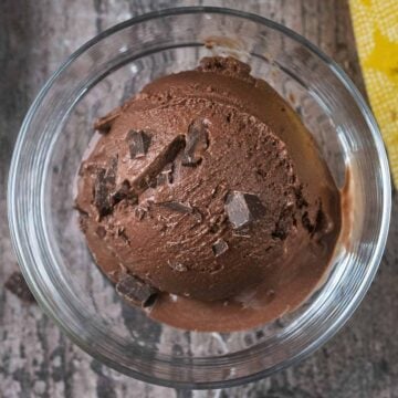 A ball of Ninja Creami chocolate fudge ice cream in a serving glass.