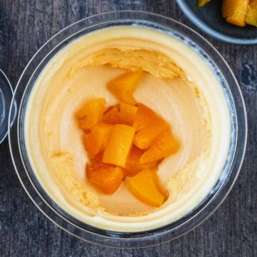 Ninja Creami Peach Ice Cream in the Creami tub.