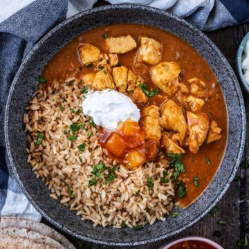 Quick coconut chicken curry in a bowl with brown rice.