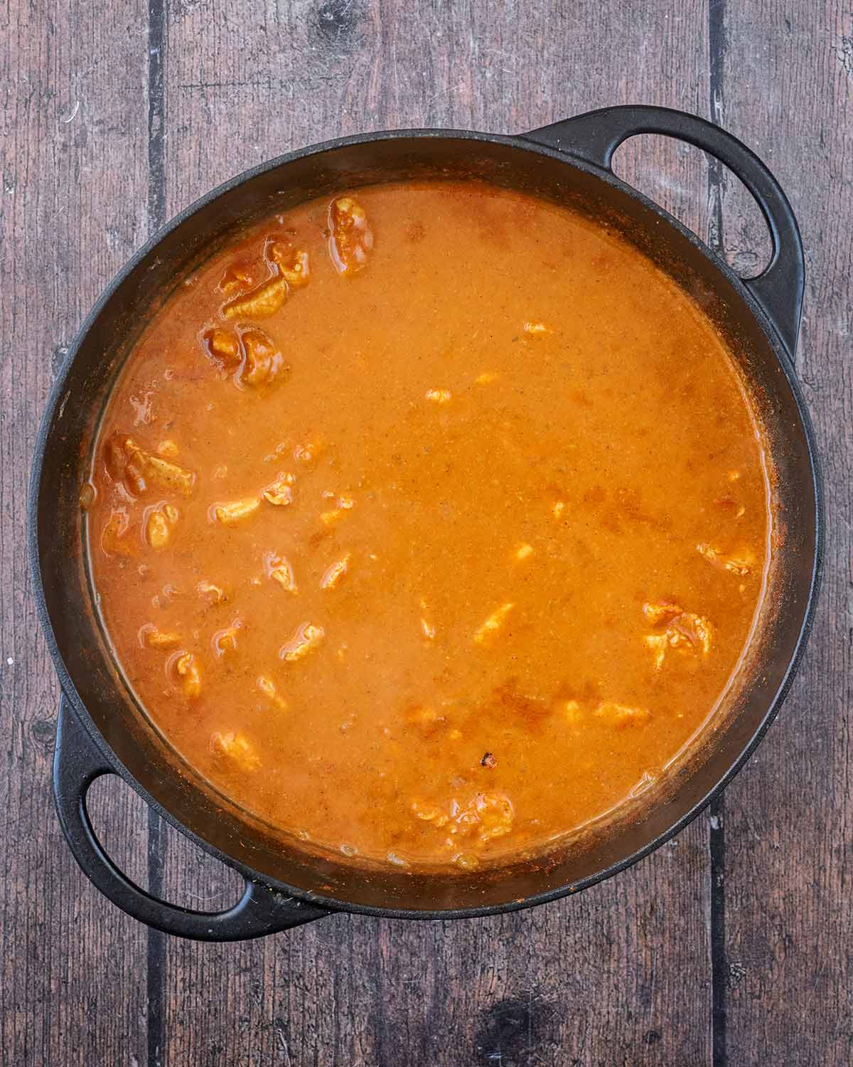 Cooked chicken curry in the pan.