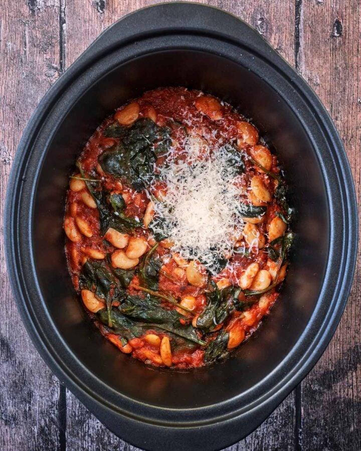 Grated parmesan added to the slow coker.