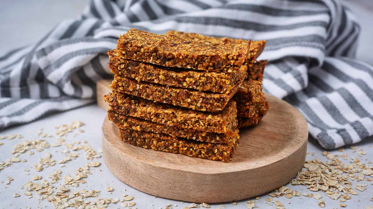 Carrot cake oat bars piled up in a stack.